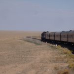 Trans-Siberian train chugging across the Gobi Desert in Mongolia.