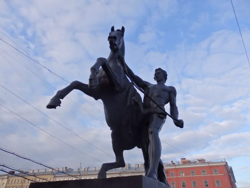 One of the four horse tamers adorning the Anichkov Bridge, along Nevsky Prospekt. St Petersburg, Russia.