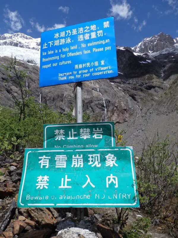 Avalanche warning at the Ice Lake/ Glacier Lake. Yubeng, Meili Snow Mountains (Meili Xue Shan). Yunnan, China.