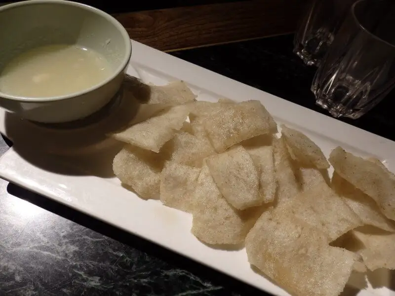 Deep fried pig skin with some dip. New Beijing Fried Sausage (新北京煎罐肠/ Y23). 印巷小馆, Nanluoguxiang, Beijing, China.