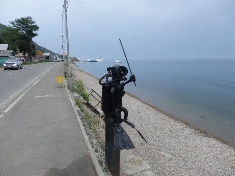 Sculpture of diver along Lake Baikal, at Listvyanka. Siberia, Russia.