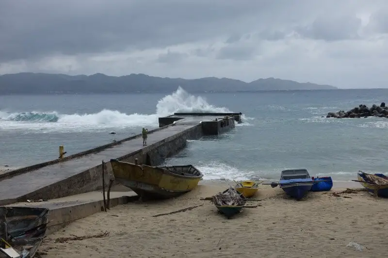 Waves hitting the pier at the Port of Ivana. Batanes, Philippines.